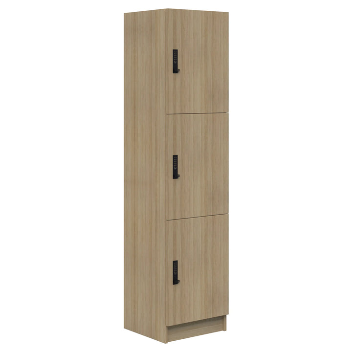 The Mascot Lockers by Home Office Space NZ are tall, rectangular wooden storage cabinets with customizable interiors, three vertical doors with black handles, a light natural finish, and a small base for stylish and practical organization.