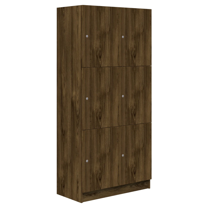 The Mascot Lockers by Home Office Space NZ are tall wooden storage cabinets in a dark brown wood grain finish, featuring six doors with round handles, offering secure and customizable storage for any space.