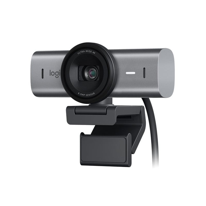A grey or graphite Logitech MX Brio Ultra HD 4K Webcam from Home Office Space NZ, featuring a cylindrical body and a central lens. It includes an adjustable clip-on mount for easy attachment to monitors and has a connected cable. The webcam lens is labeled "Ultra HD 4K Resolution" and "8.5 MP Sensor," utilizing an Advanced STARVIS Sensor for superior image quality.