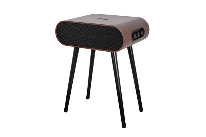 The MySound Jazz Speaker Side-Table by Home Office Space NZ is a modern table with a sleek, rectangular design on four black legs, featuring a wooden side finish, gray top, and black front grille. It includes an integrated sound system, wireless charging, and a side control panel.