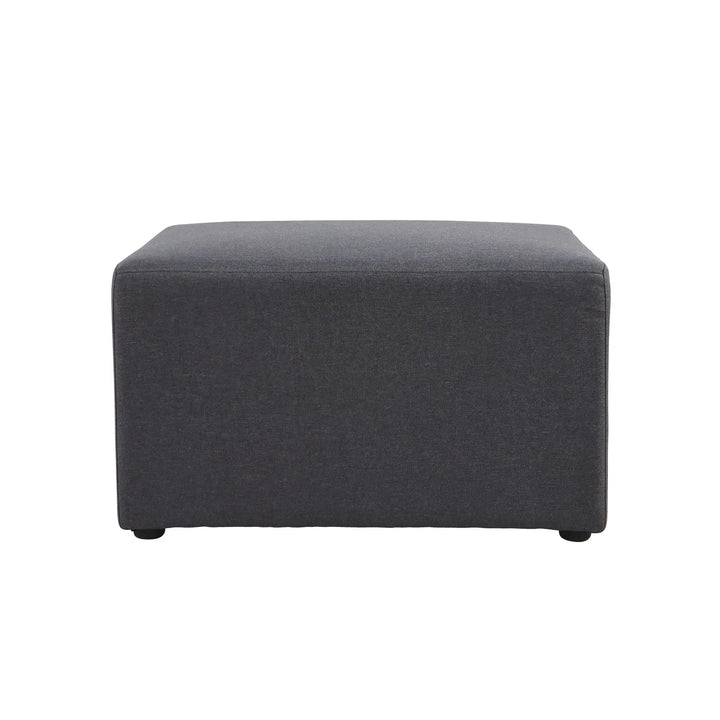 The Konfurb Arco Series by Home Office Space NZ is a square, dark grey fabric ottoman featuring an exceptional minimalist design. It stands on small, barely noticeable legs and has a smooth, cushioned top, making it suitable for use as a footrest or a small coffee table. Ideal for evolving work environments, this ottoman is showcased against a plain white background.