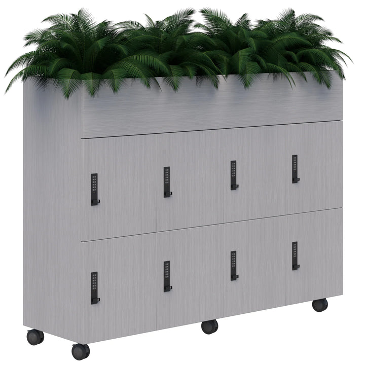 The Mascot Lockers by Home Office Space NZ is a light gray mobile planter locker on wheels with six customizable lockers, black combination locks, and a planter top with lush green ferns—offering secure storage and style.